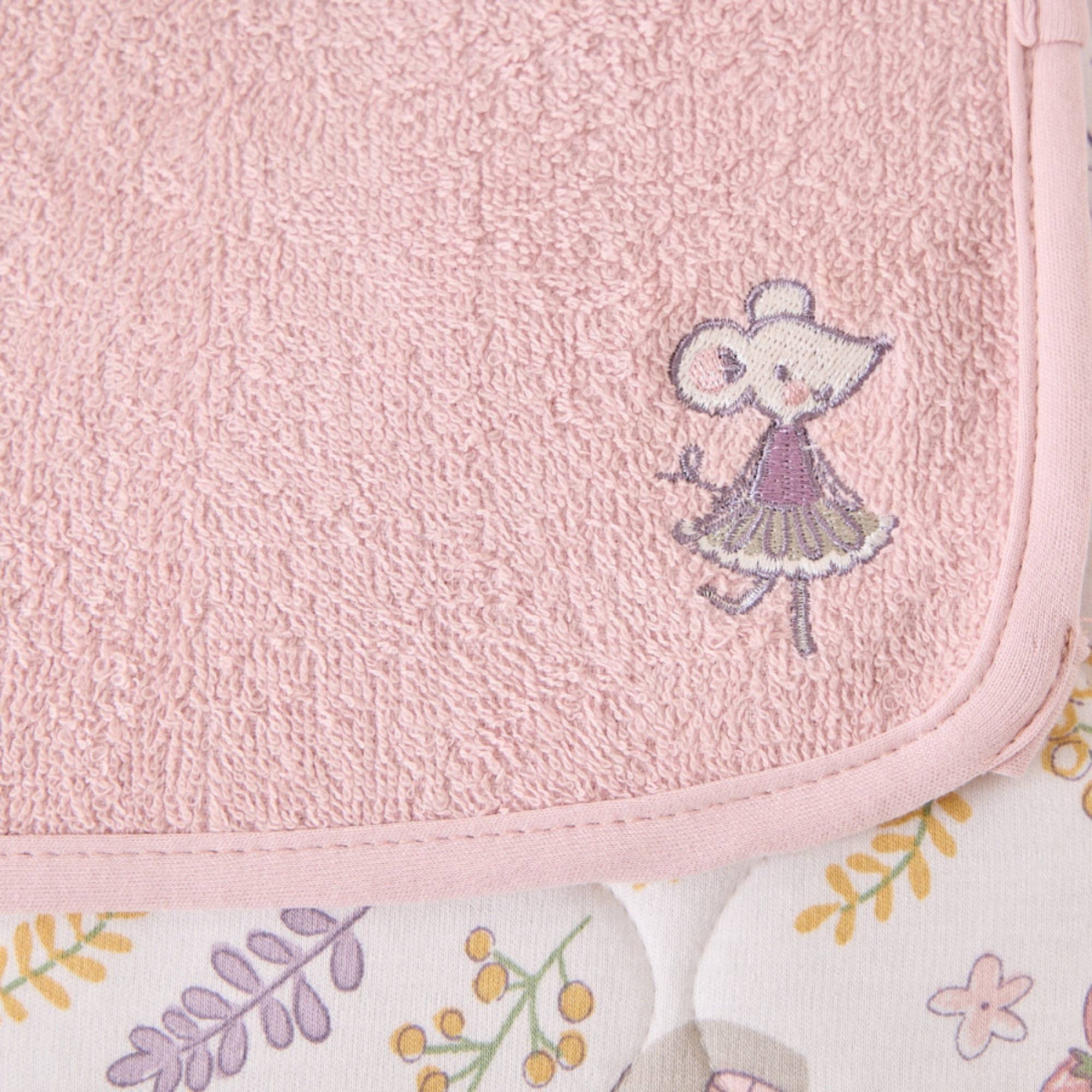 Detail of an embroidered mouse on the luxury changing mat