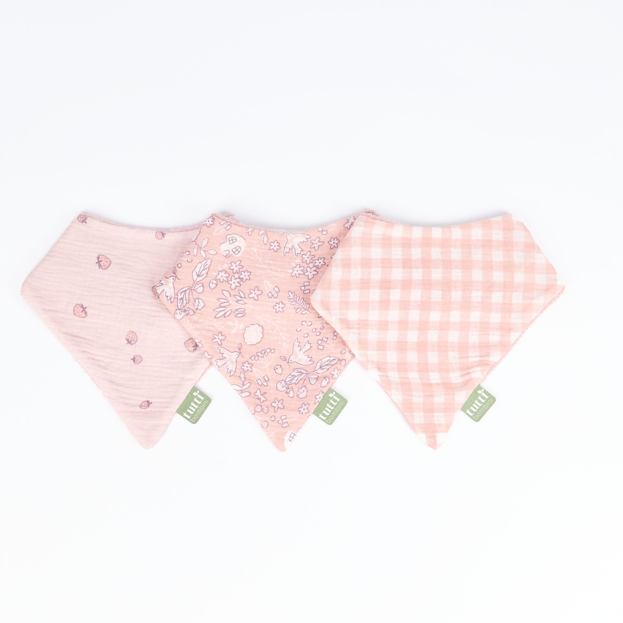 Three pink baby bibs with different patterns of the Tiny Tails collection, on a white background