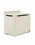 An angle view of the Origin toy box in cashmere designed with rounded edges and a gap-front opening to minimize pinch points and maximize child safety.