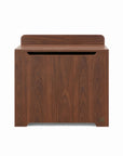Origin toy box in walnut designed with rounded edges and a gap-front opening to minimize pinch points and maximize child safety.