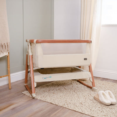 CoZee Air Bedside Crib in Scandinavian Walnut/Ecru - lifestyle image in room setting, showing the crib with rocking bars attached