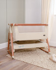 CoZee Air Bedside Crib in Scandinavian Walnut/Ecru - lifestyle image in room setting, showing the crib with rocking bars attached