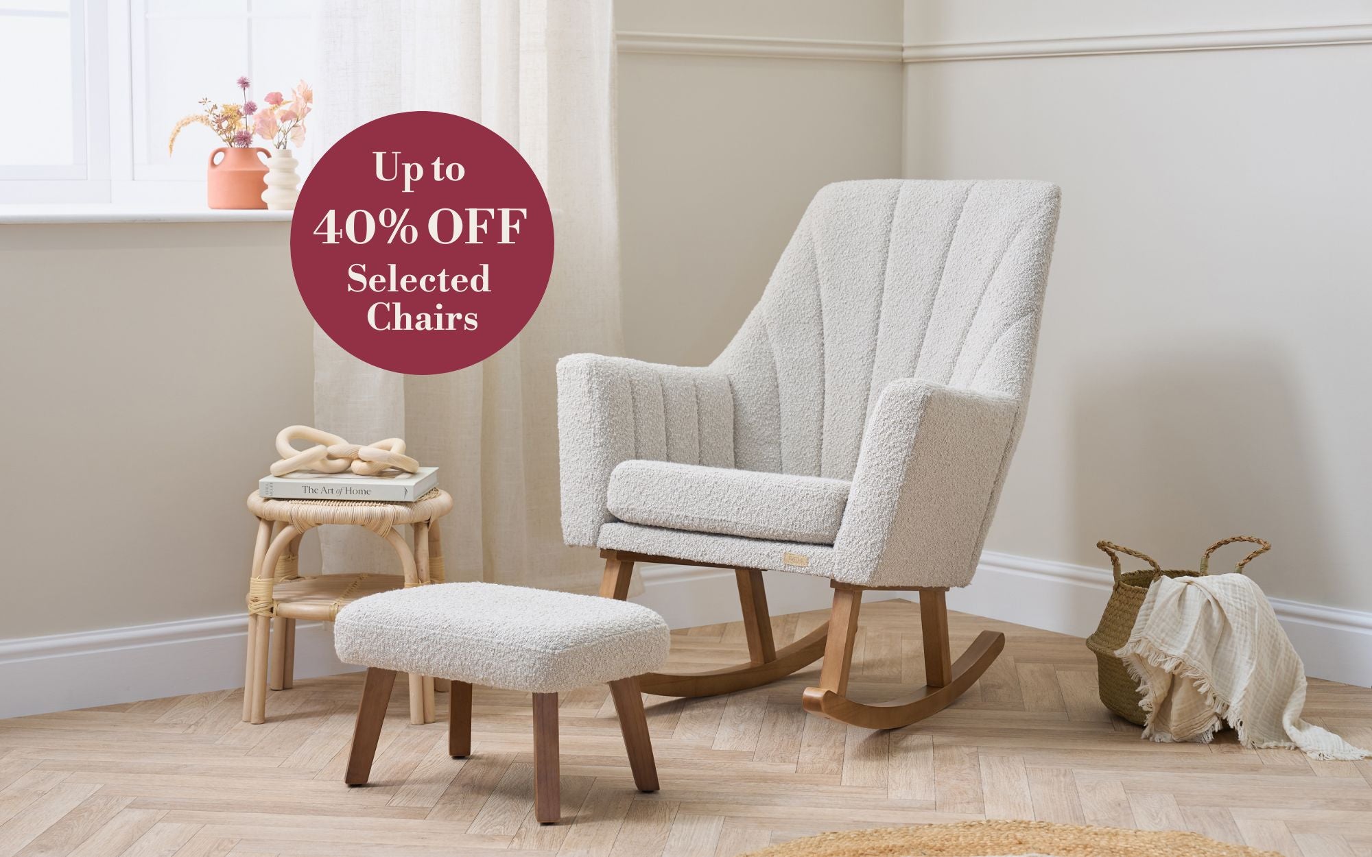 Jonah Luxe rocking chair in mushroom with ottoman in a room with a sale sign for chairs.