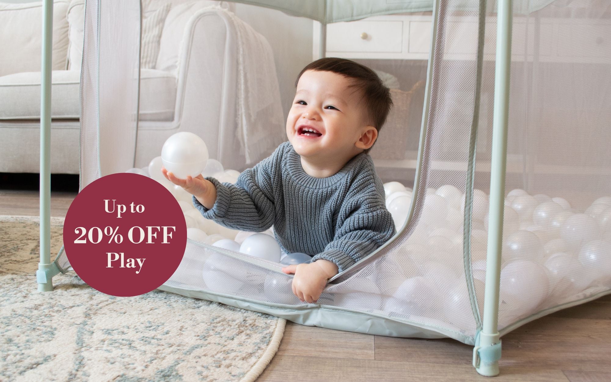 Child playing inside Hexa playpen with a 'Up to 20% Off Play' offer in the corner.