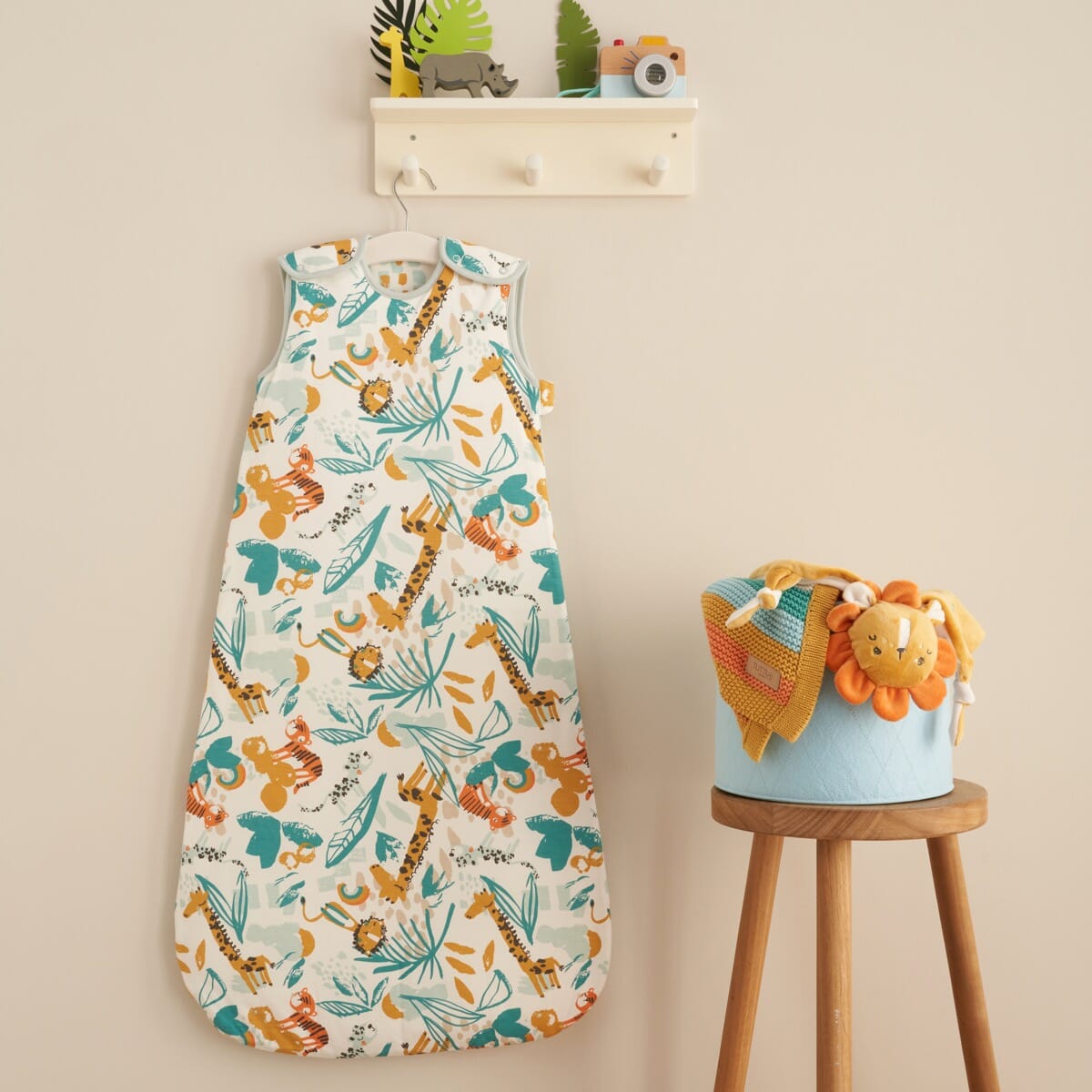 Lifestyle view of baby sleep bag 0–6 months in Run Wild hung in nursery, adding colour and charm to baby’s sleep space décor