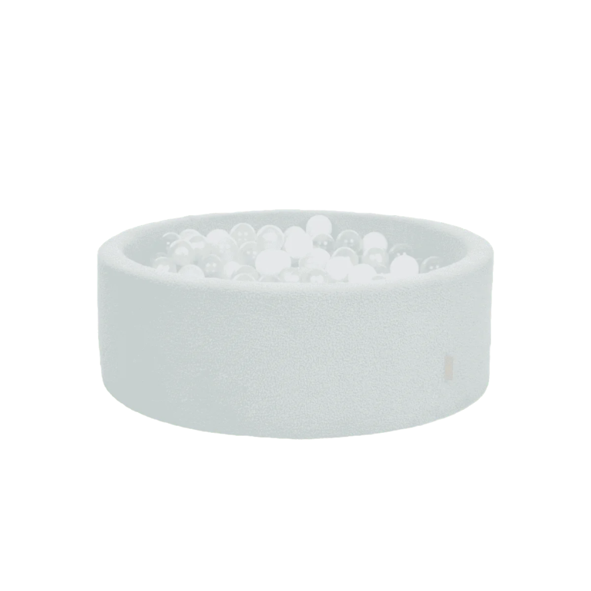 Cutout view of the Bola baby ball pit in sea mist, showcasing the soft boucle finish, circular shape, and white balls for gentle sensory play