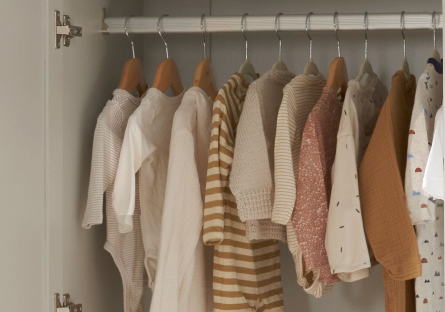 baby clothes neatly hanging in the rio wardrobe