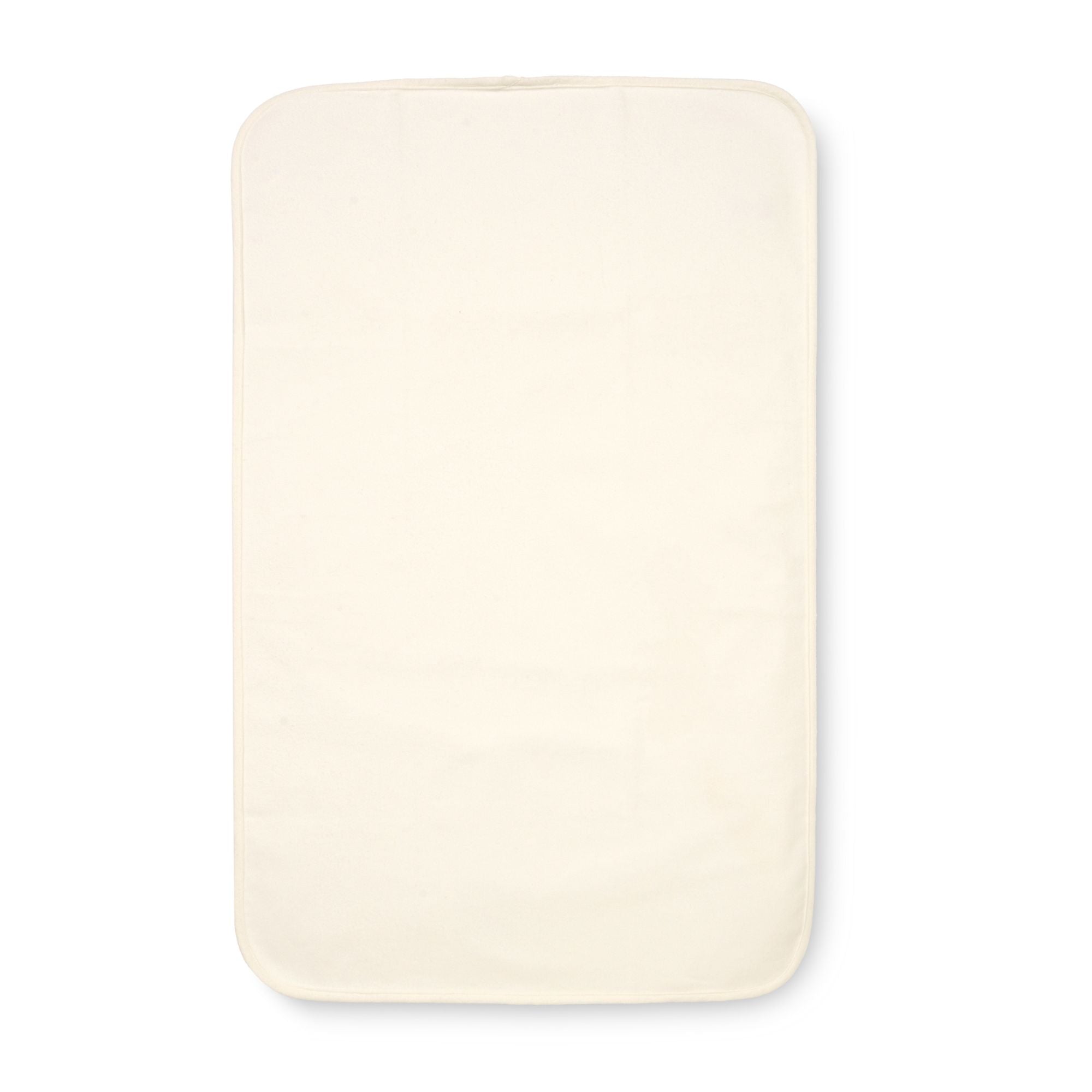 Cutout view of the CoZee bedside crib waterproof mattress protector in cream cotton, offering soft comfort and full protection