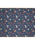 Opened out view of the Our Planet cot and cot bed coverlet featuring an ocean-themed print with octopuses, jellyfish, starfish