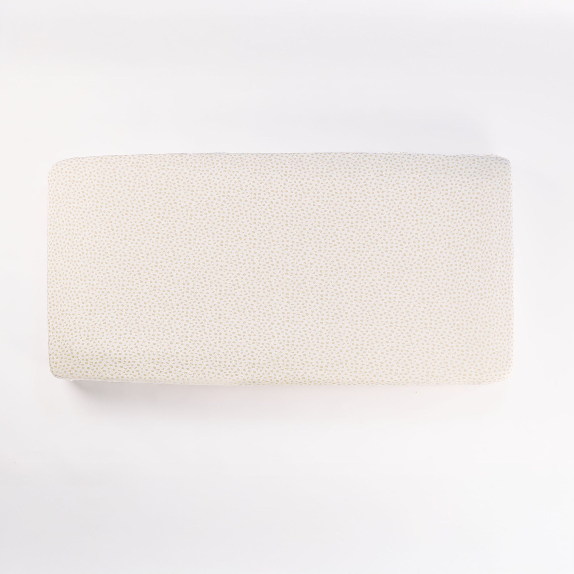 Cutout view of the Love Cats fitted sheet in cream with subtle dotted pattern, crafted in soft stretch bamboo jersey fabric