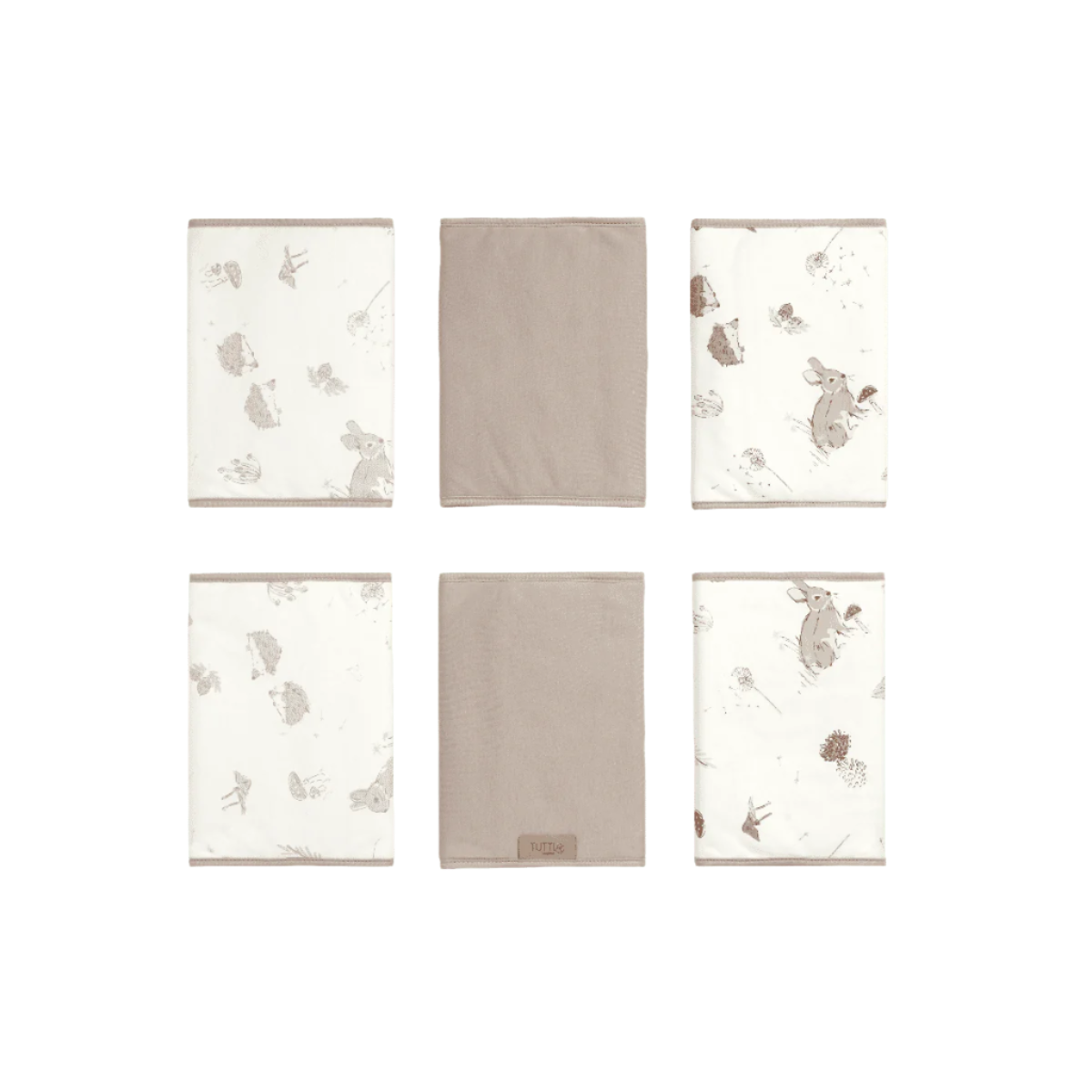 Set of Cocoon cot wraps shown in patterned and plain neutral designs, offering padded comfort and versatile nursery styling