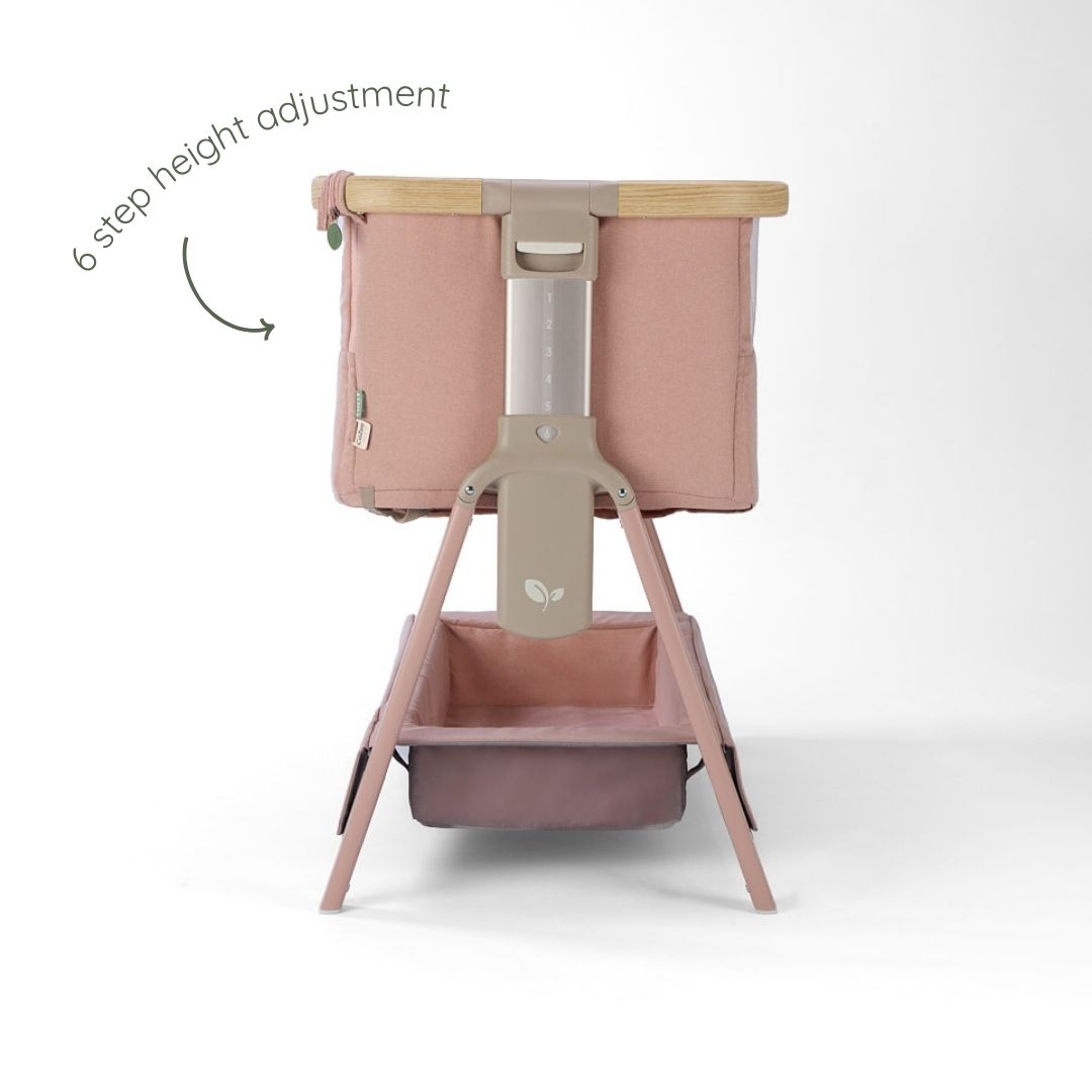CoZee Air 2 bedside crib in drifted oak and blush showing gentle tilt function designed to help ease reflux.
