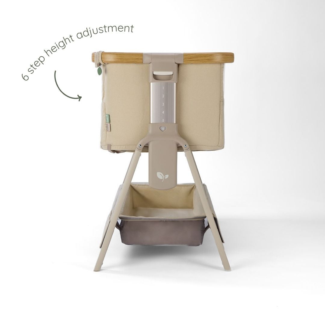 CoZee Air 2 bedside crib in toasted oak and sand demonstrating gentle incline setting to support reflux relief.