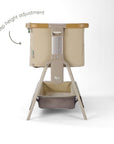 CoZee Air 2 bedside crib in toasted oak and sand demonstrating gentle incline setting to support reflux relief.