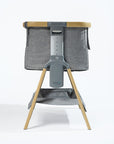 CoZee Air in Oak and Charcoal – product cutout showing adjustable height positions and rocking leg frame