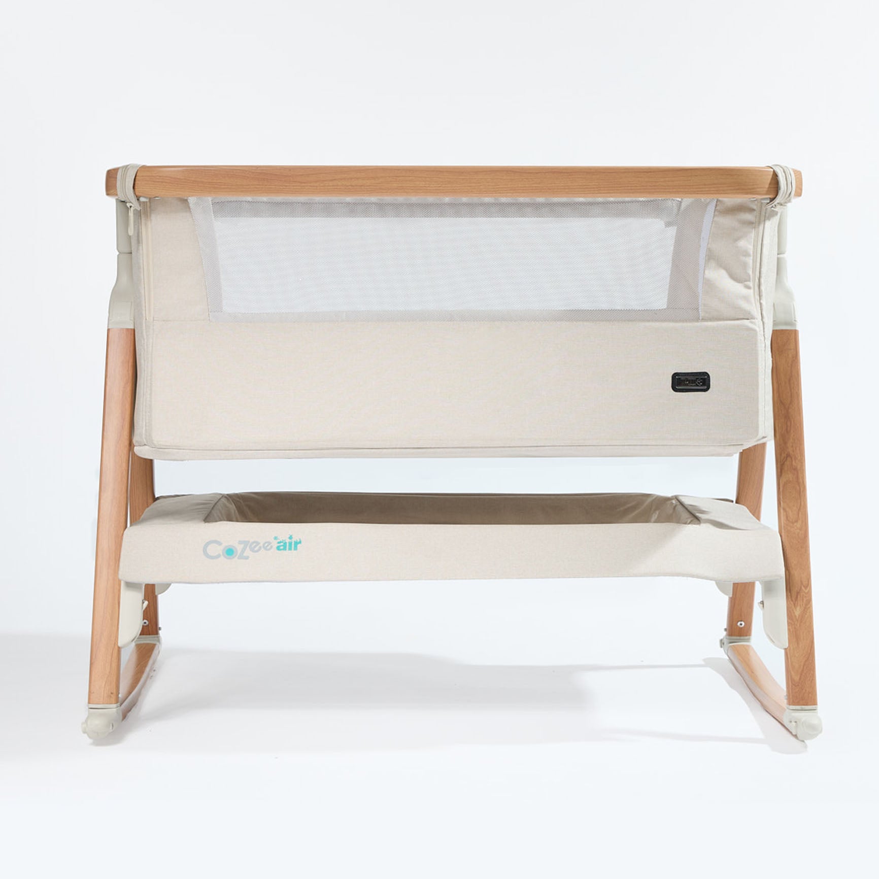 CoZee Air Bedside Crib in Scandinavian Walnut and Ecru – front cutout showing mesh side panel and oak-effect frame and rocking bars
