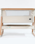 CoZee Air Bedside Crib in Scandinavian Walnut and Ecru – front cutout showing mesh side panel and oak-effect frame and rocking bars