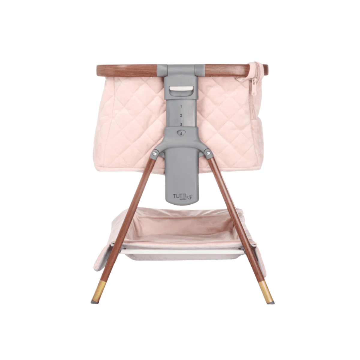 Side view of the CoZee Luxe Mini Me crib in walnut and blush finish, showing quilted fabrics, compact frame, and subtle detailing