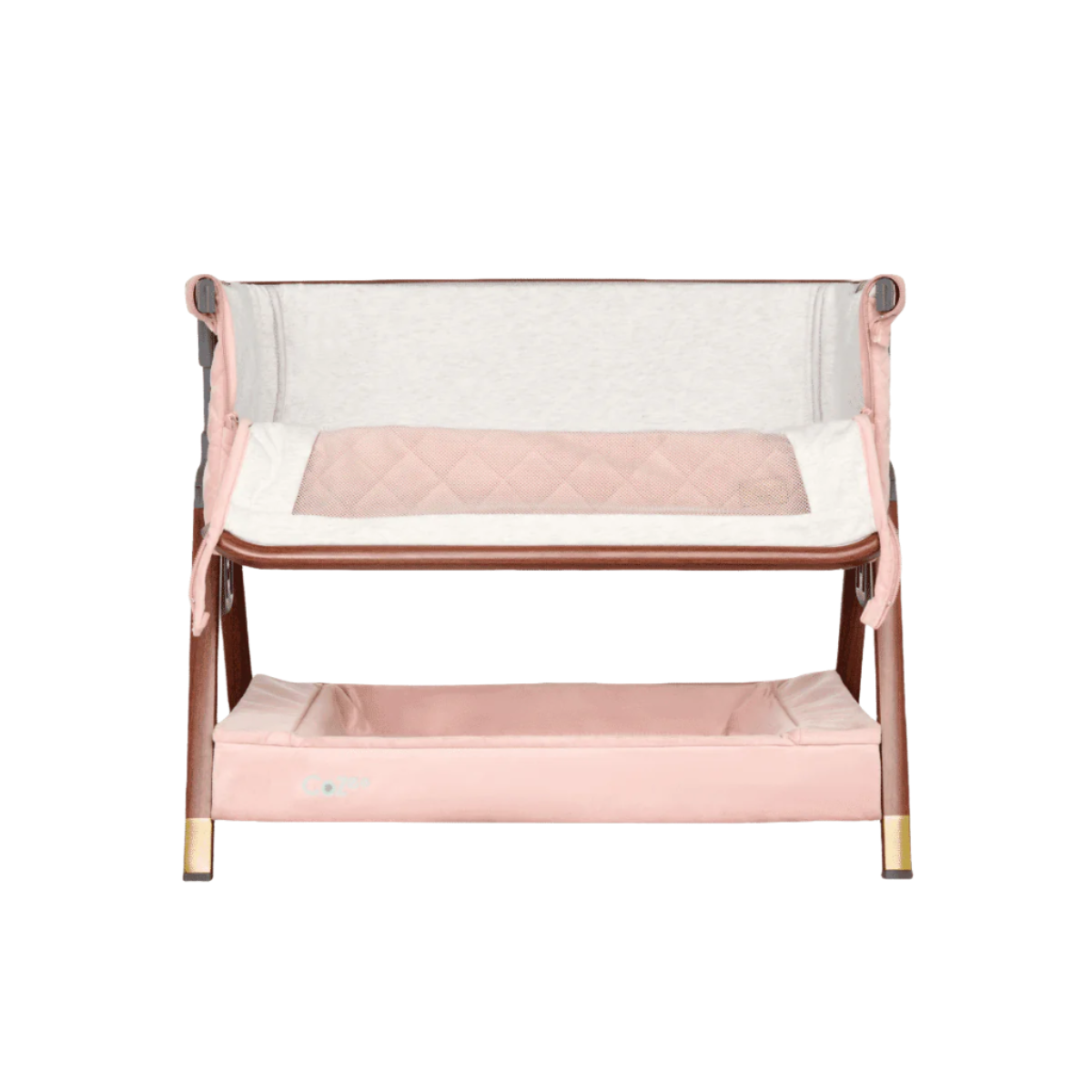Front-facing view of the CoZee Luxe Mini Me crib in walnut and blush with zipped-down panel, showing co-sleeping access and soft interior lining