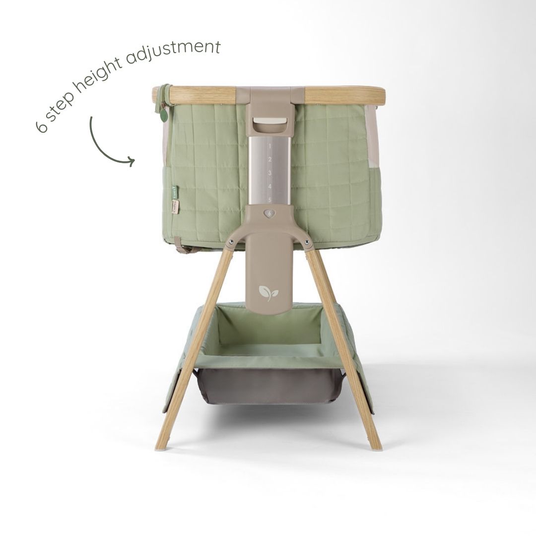 CoZee Sense bedside crib in drifted oak and eucalyptus featuring 6-step height adjustment and quilted side panels.