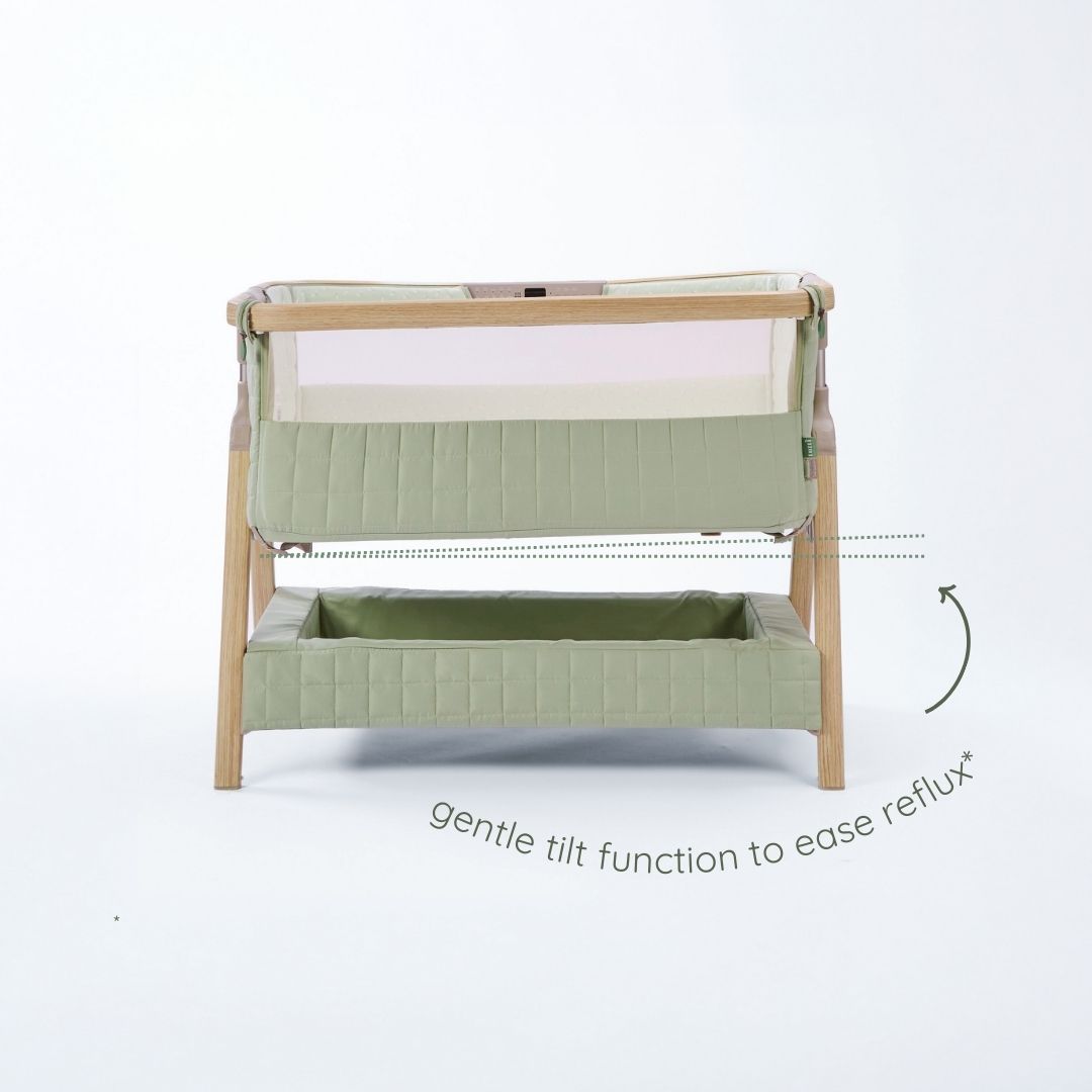 CoZee Sense bedside crib in drifted oak and eucalyptus showing gentle tilt function designed to help ease reflux.