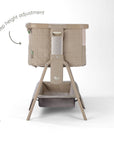 CoZee Sense bedside crib in soft walnut and cocoa showing 6-step height adjustment with quilted fabric panels.