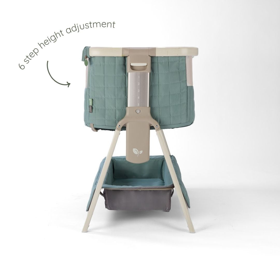 CoZee Sense bedside crib in whitewash and kelp with 6-step height adjustment and supportive A-frame base.