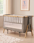 CoZee XL in oak and charcoal set up as a full-size cot, featuring slatted sides, grey fabric, and a spacious sleeping area
