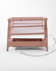 CoZee Zen bedside crib in blush demonstrating gentle tilt function to help ease reflux and support baby comfort.