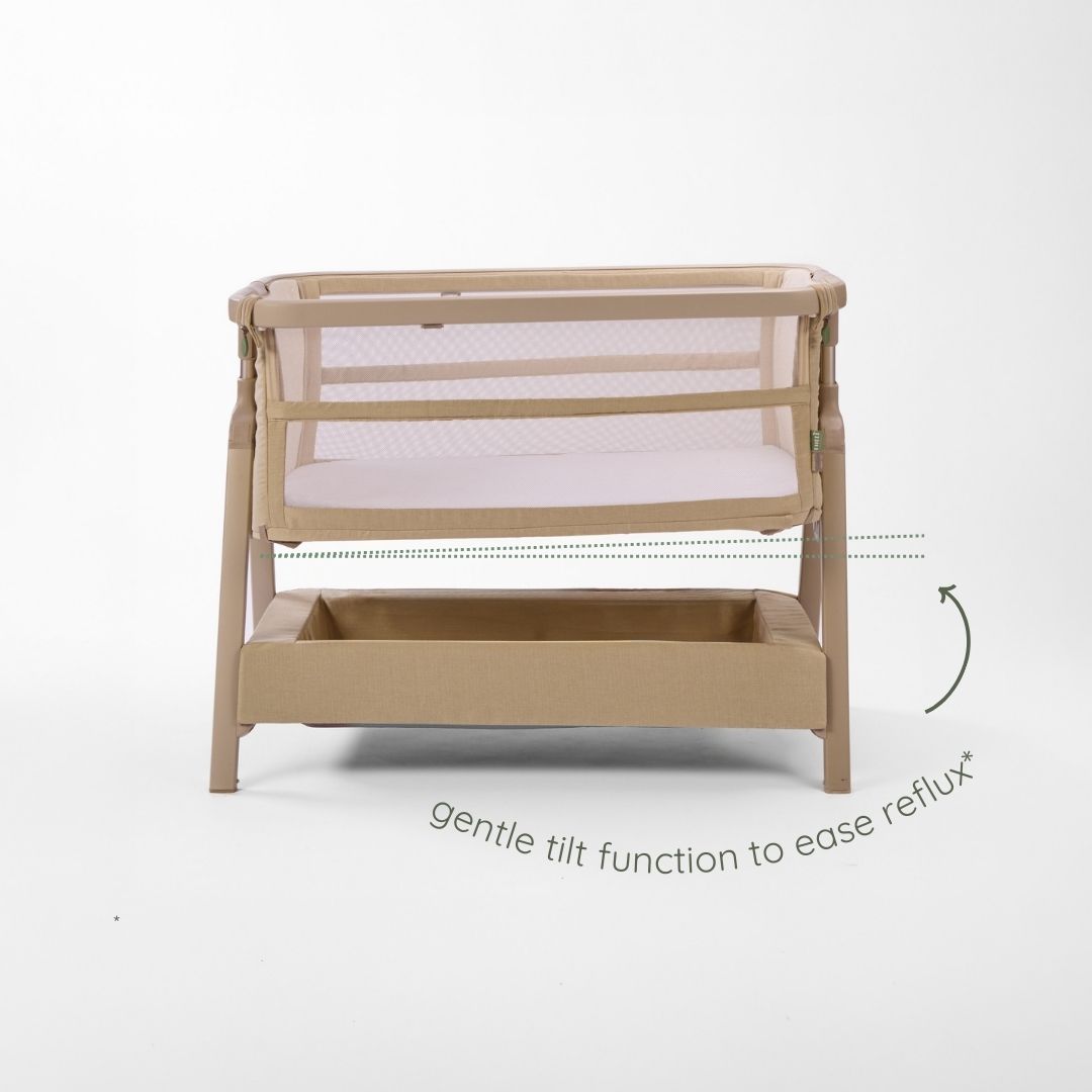 CoZee Zen bedside crib in sand demonstrating gentle incline setting designed to help ease reflux.