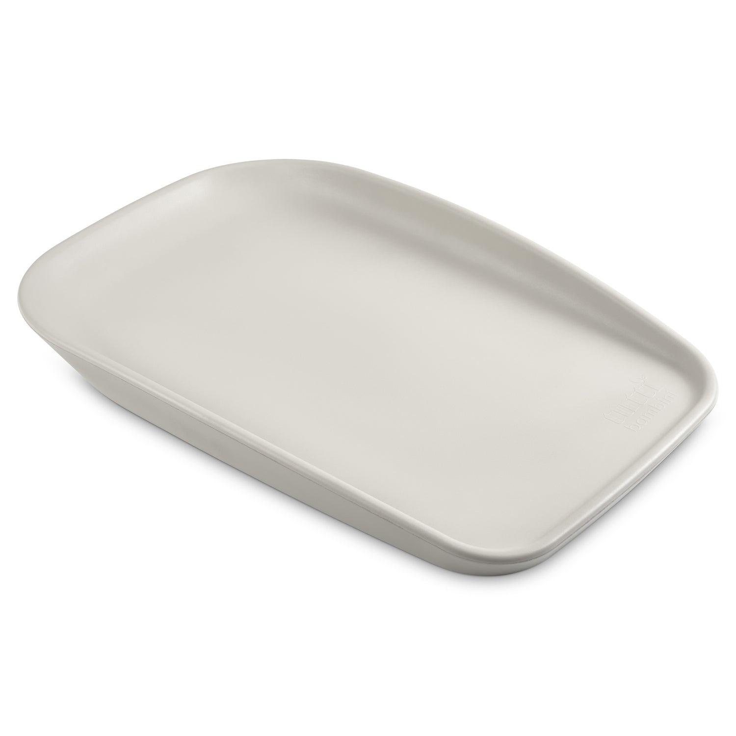 Angled view of the Cushi Mini Baby Changing Mat in mushroom, highlighting its ergonomic shape and supportive raised sides.