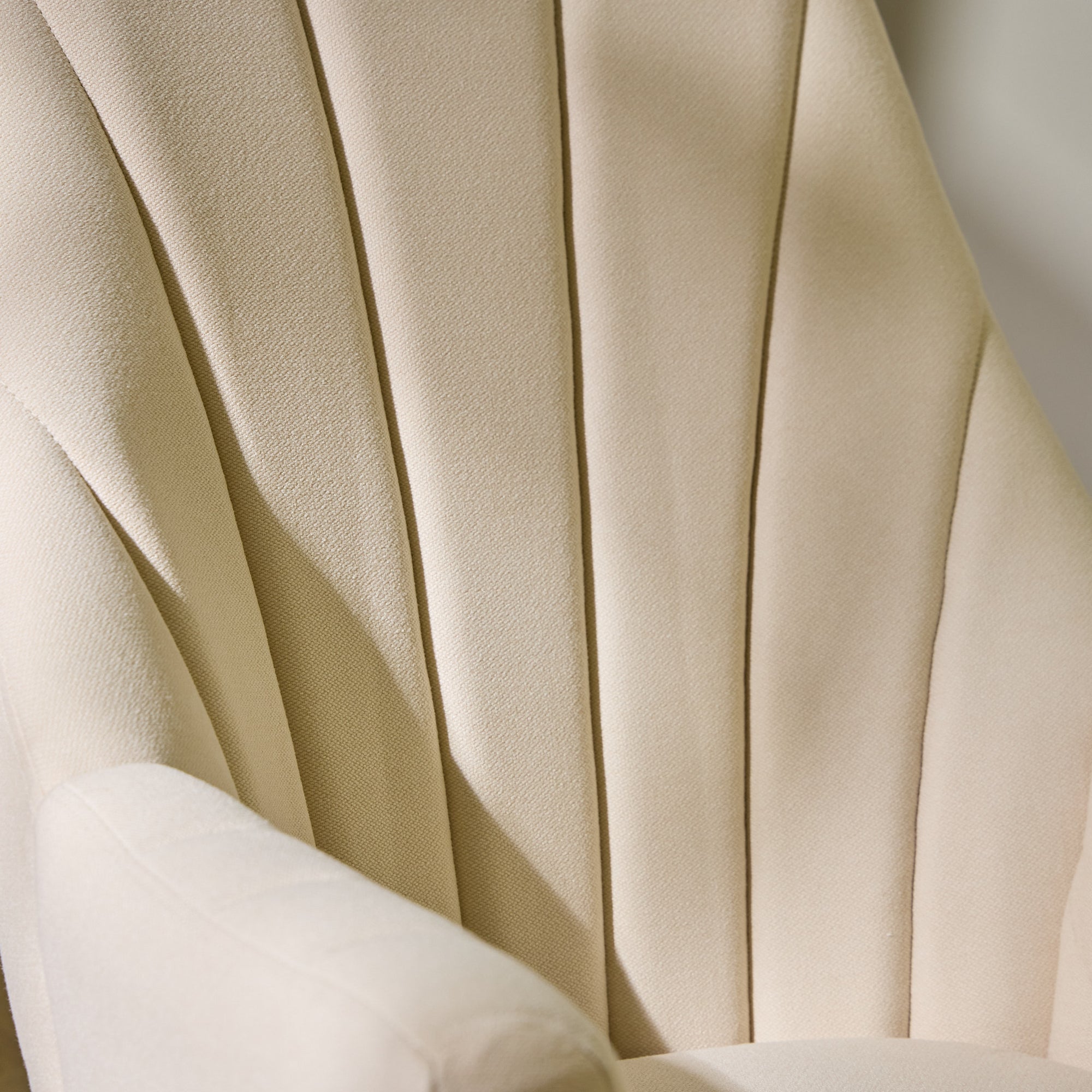 Close-up of the Danica rocking chair in cashmere showing fluted upholstery and refined texture, designed for style and everyday comfort