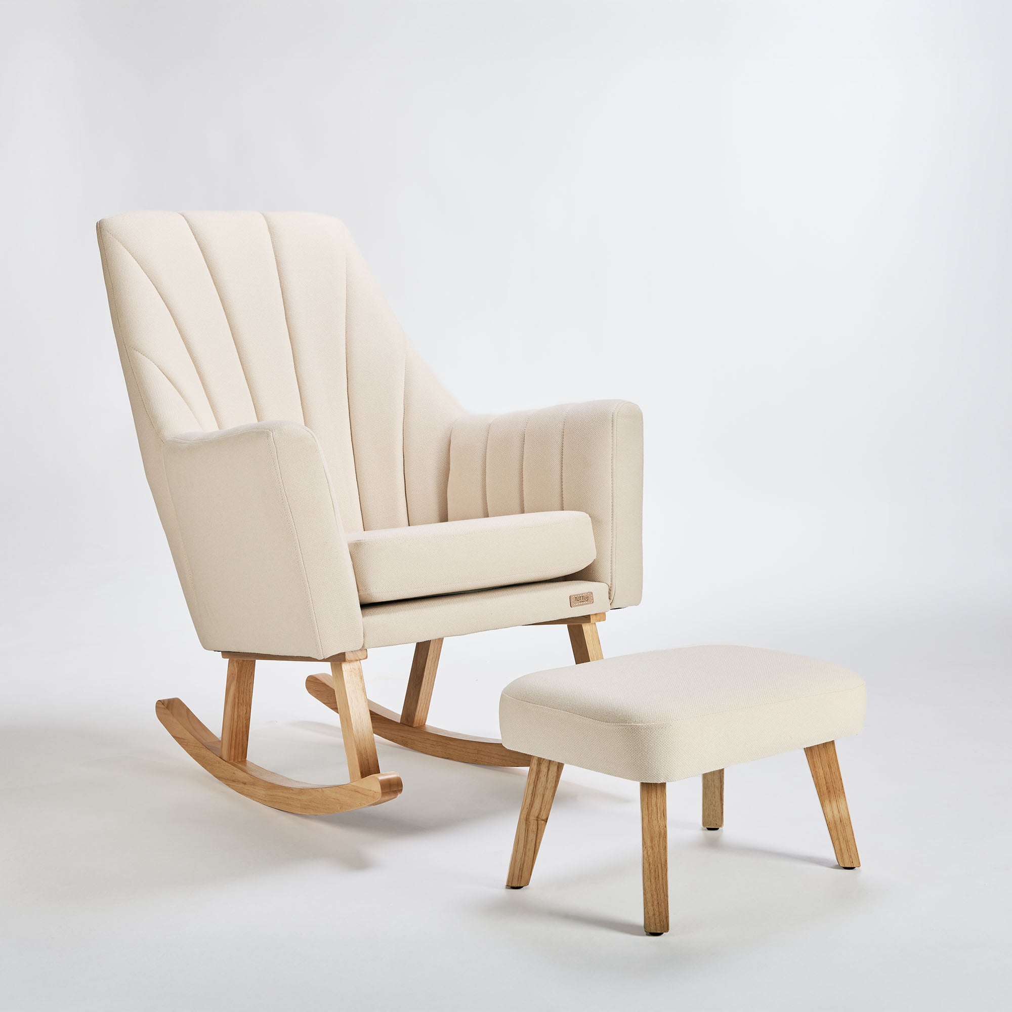 Cutout of the Danica rocking chair and footstool in cashmere with oak legs, offering timeless comfort and a serene, modern aesthetic