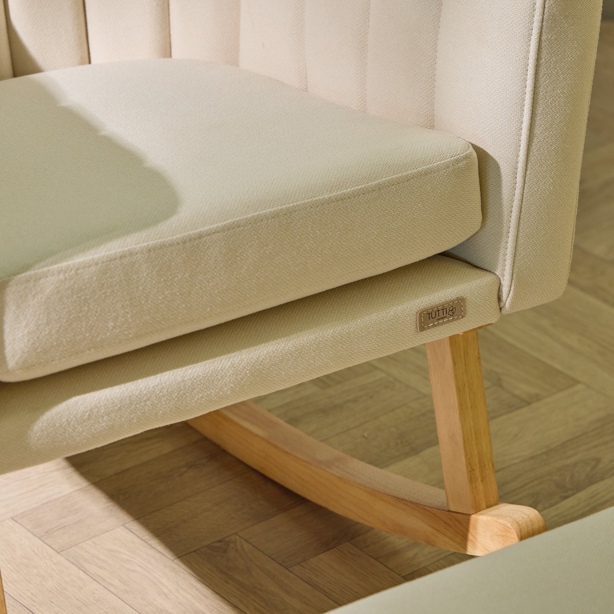 Danica rocking chair in cashmere showing gentle motion, cushioned comfort, and oak rocking frame base