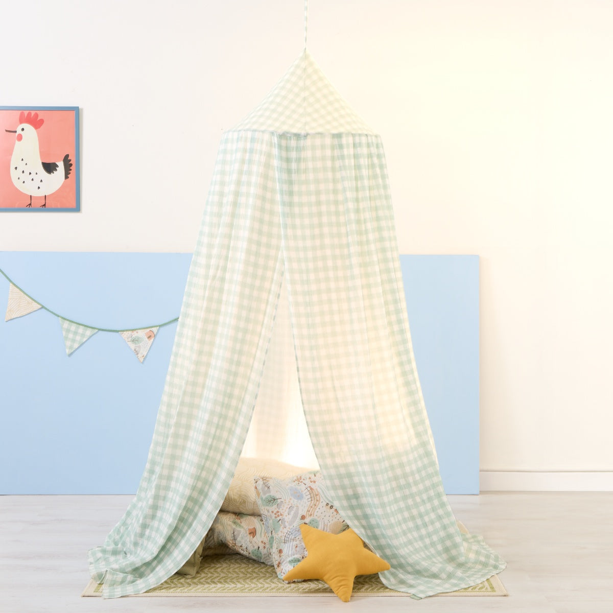 Lifestyle view of the Good Life nursery canopy in mint gingham with soft lighting, star cushion and floor mat creating a cosy den space