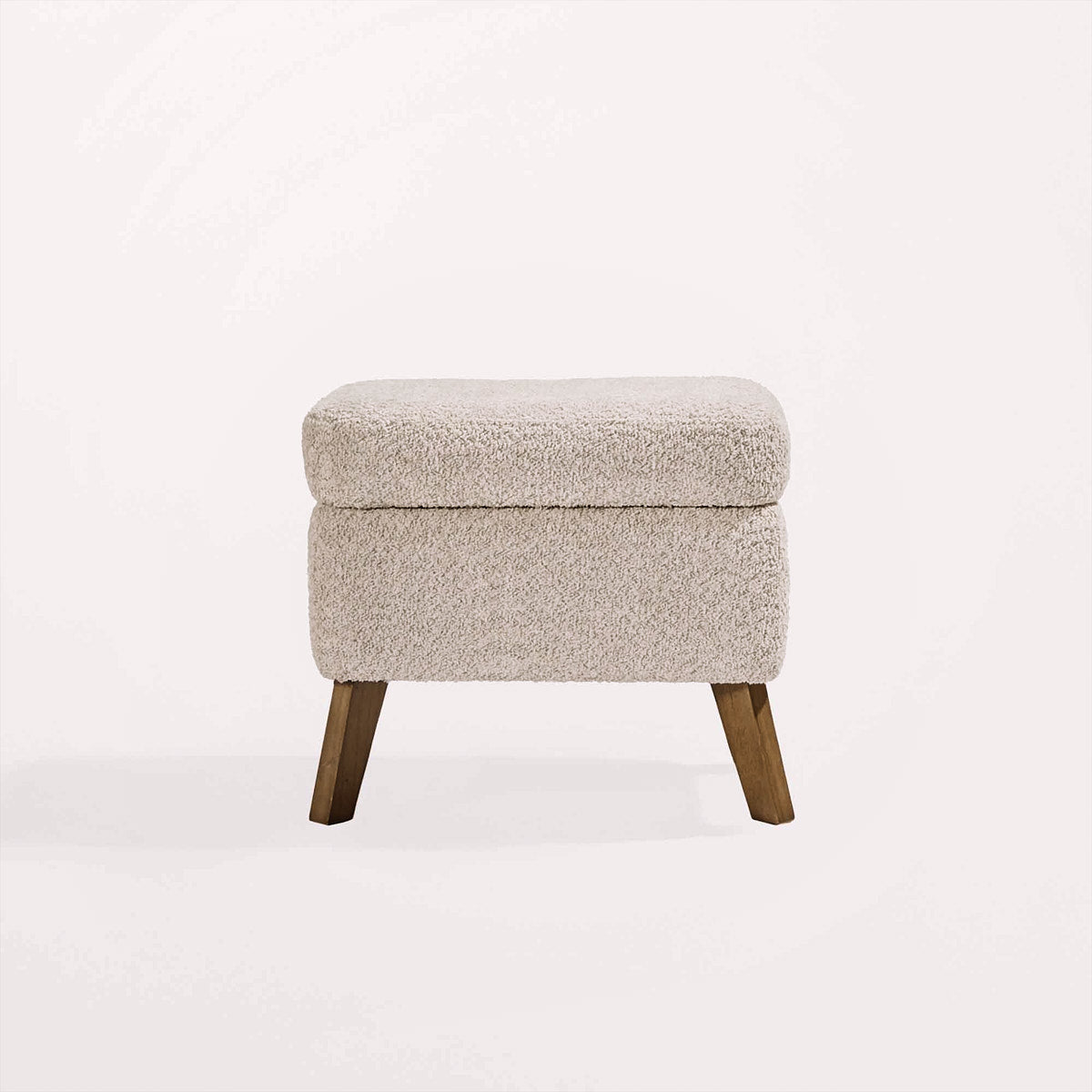 Cutout view of the Harper footstool in teddy mushroom with oak legs and boucle-style upholstery, ideal for resting feet or storing essentials