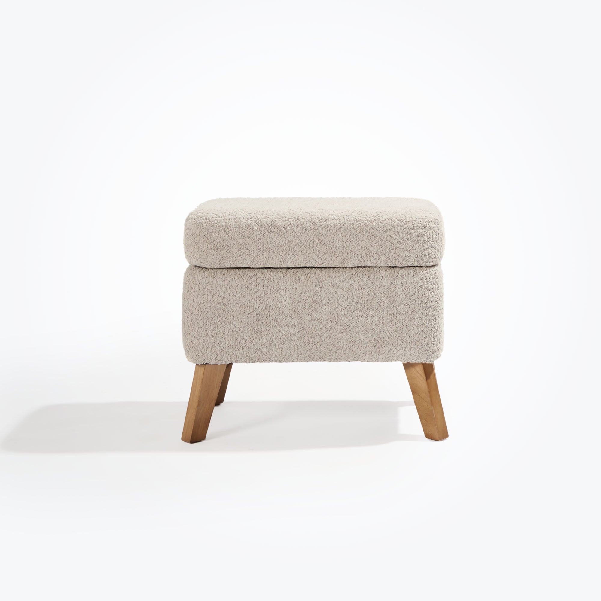 Cutout view of the Harper footstool in teddy mushroom with oak legs and boucle-style upholstery, ideal for resting feet or storing essentials