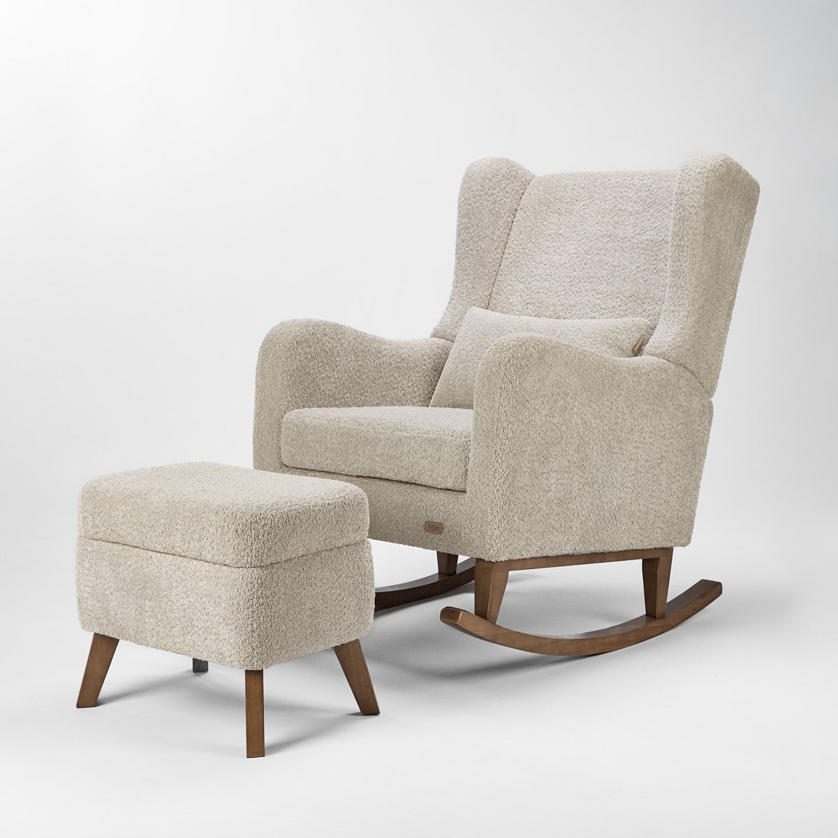 Cutout of the Harper Wingback rocking chair and footstool in teddy mushroom with footstool lid shut 