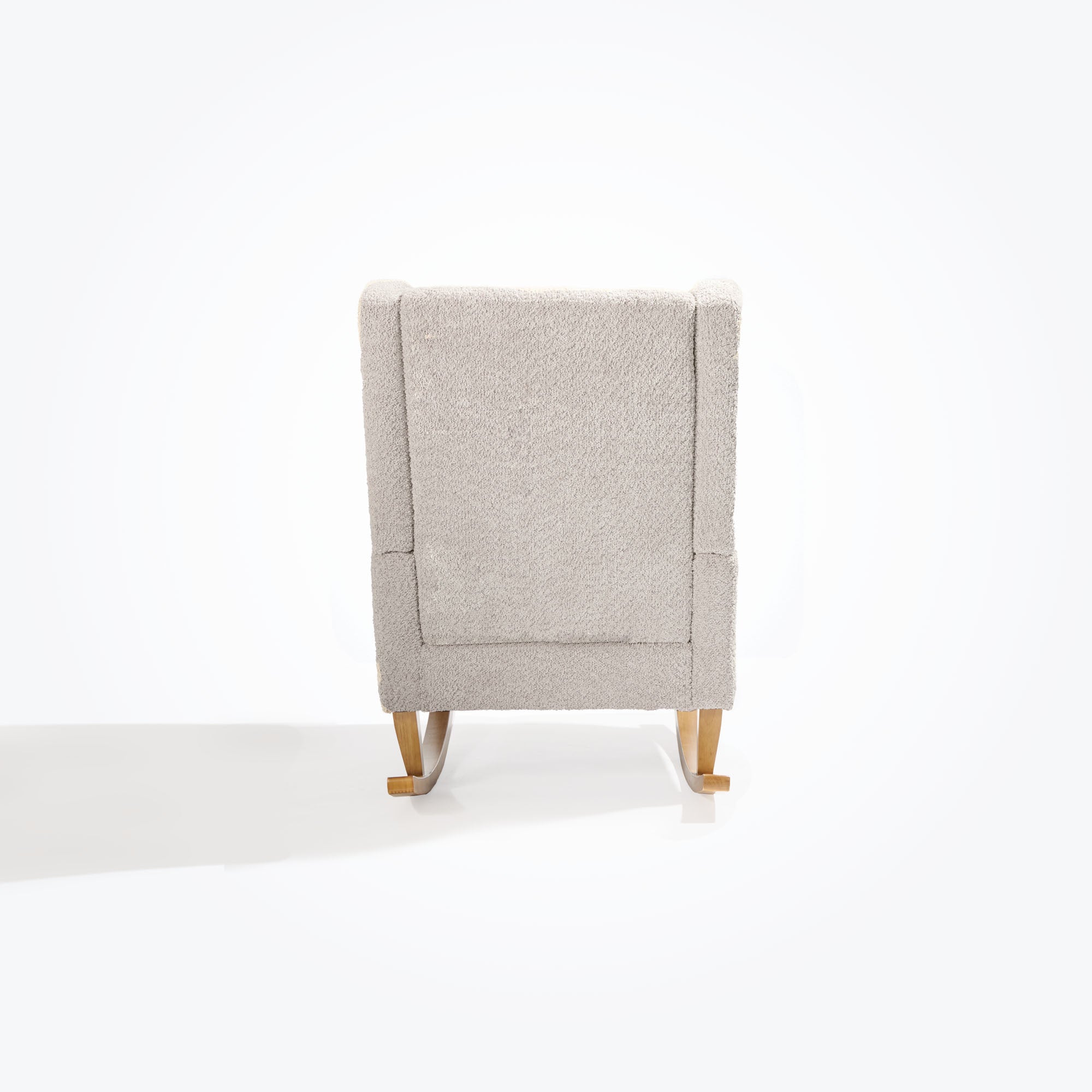 Back cutout of the Harper Wingback rocking chair in teddy mushroom, highlighting soft textured upholstery and gently flared silhouette.