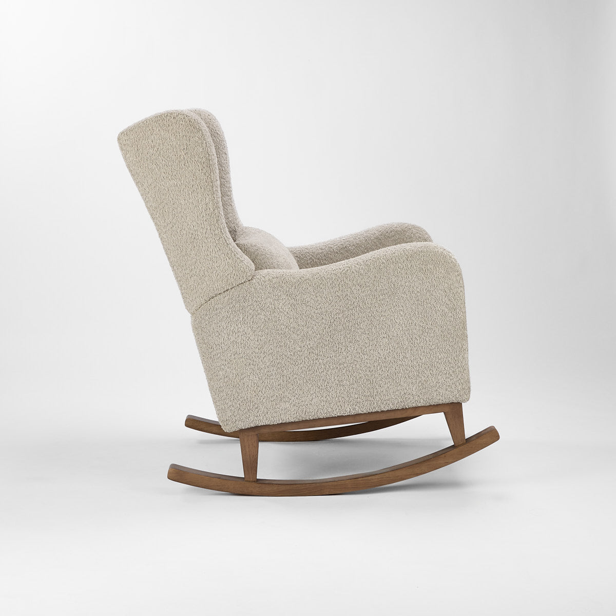 Side cutout of the Harper Wingback rocking chair in teddy mushroom, featuring smooth rocking motion and generous armrest profile.