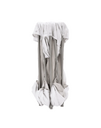 Collapsed Hexa playpen in grey shown folded upright, highlighting its lightweight frame and easy fold design for storage