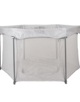 Hexa playpen in grey with mesh sides and front zip door, offering a spacious, breathable play area for babies and toddlers