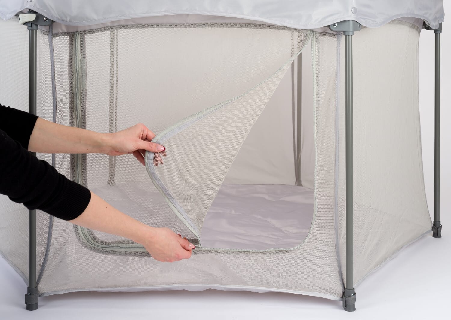 Close-up of the Hexa playpen’s front zip-open mesh door, highlighting easy parent access and breathable panels for comfortable supervised play