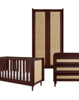 Japandi nursery furniture set in warm walnut, including cot bed, chest changer, and wardrobe with rattan panels, offering a coordinated look and multifunctional storage solutions.