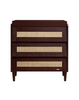 Japandi chest changer in warm walnut with three spacious drawers, rattan detailing, and a removable changing top for versatile use.