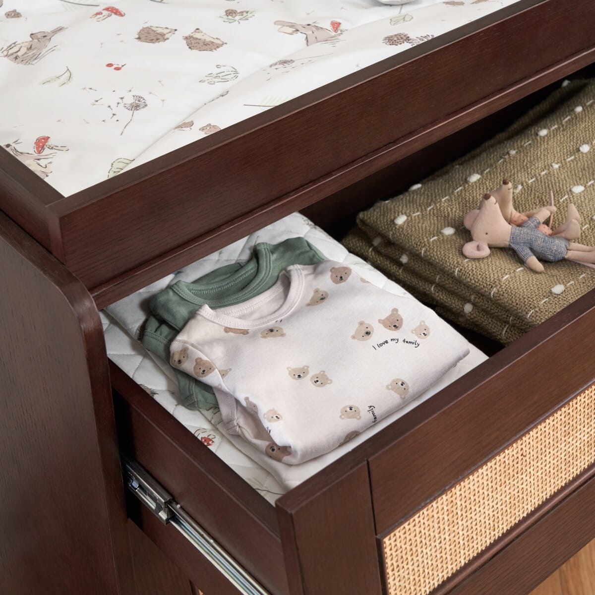 Japandi Chest Changer in warm walnut shown with top drawer open. Features soft-close runners and deep compartments ideal for storing baby essentials