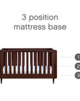 Japandi cot bed in warm walnut with adjustable 3-position mattress base, allowing for safe and ergonomic sleeping heights as your baby grows.