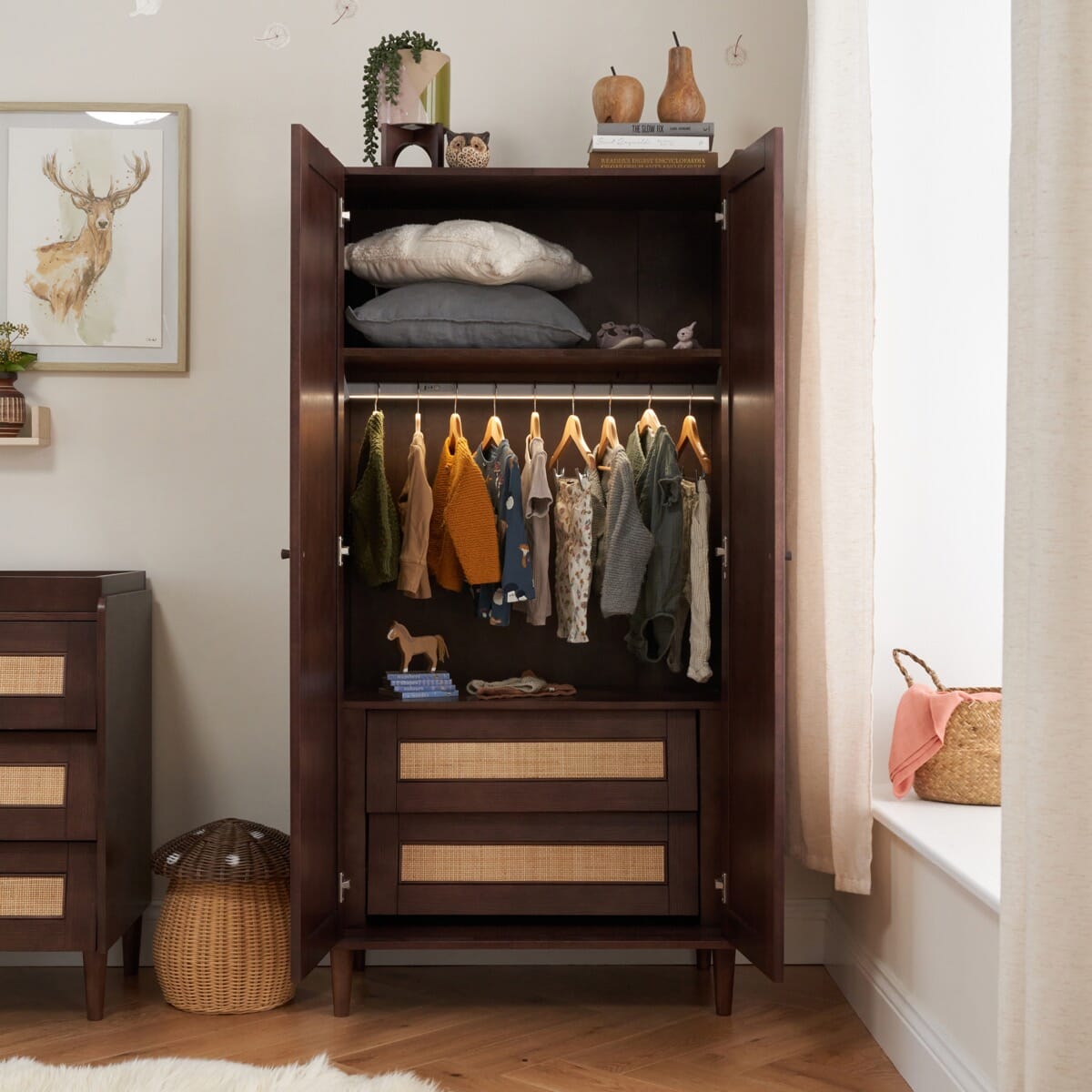 Japandi Wardrobe in warm walnut with both doors open, revealing two drawers, shelving, and a full-width hanging rail showing nursery storage versatility.