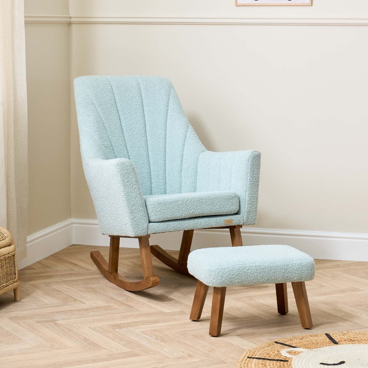 Lifestyle view of the Jonah Luxe rocking chair and footstool in boucle ocean stone, styled with soft furnishings for a serene, nurturing space