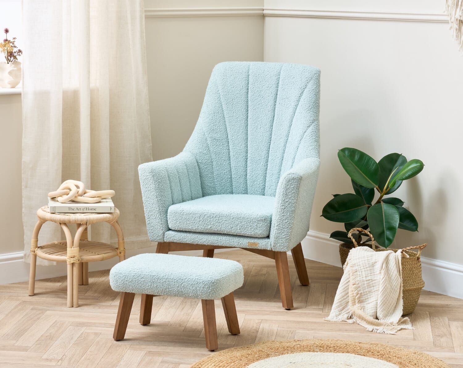 Jonah Luxe rocking chair and footstool in boucle ocean stone styled in a calm nursery corner with soft textures and warm wood tones